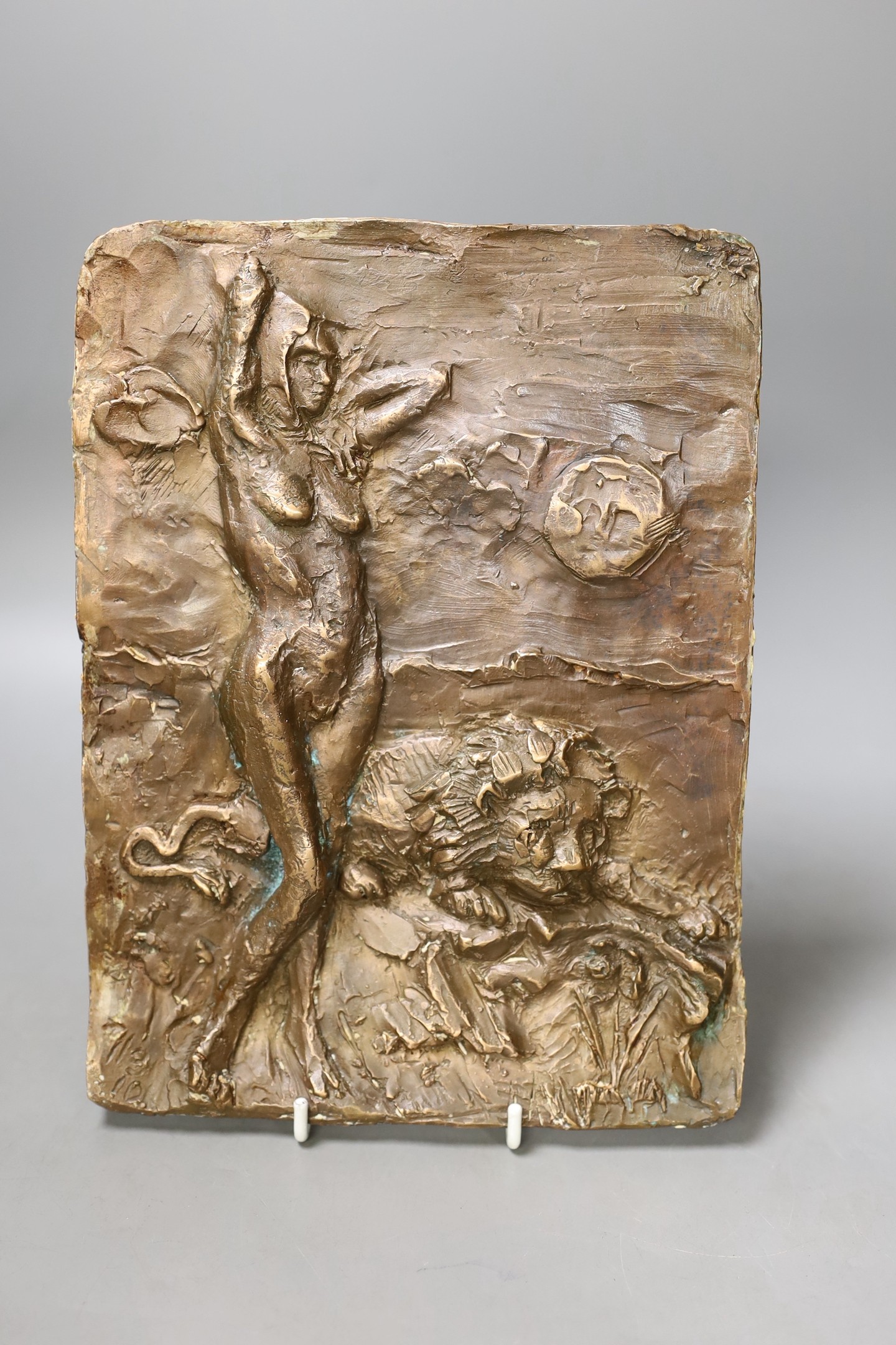 A bronze abstract wall panel depicting a female amongst a lion, 24.5 x 18.5cm, together with a vessel in the form of a toad (2)